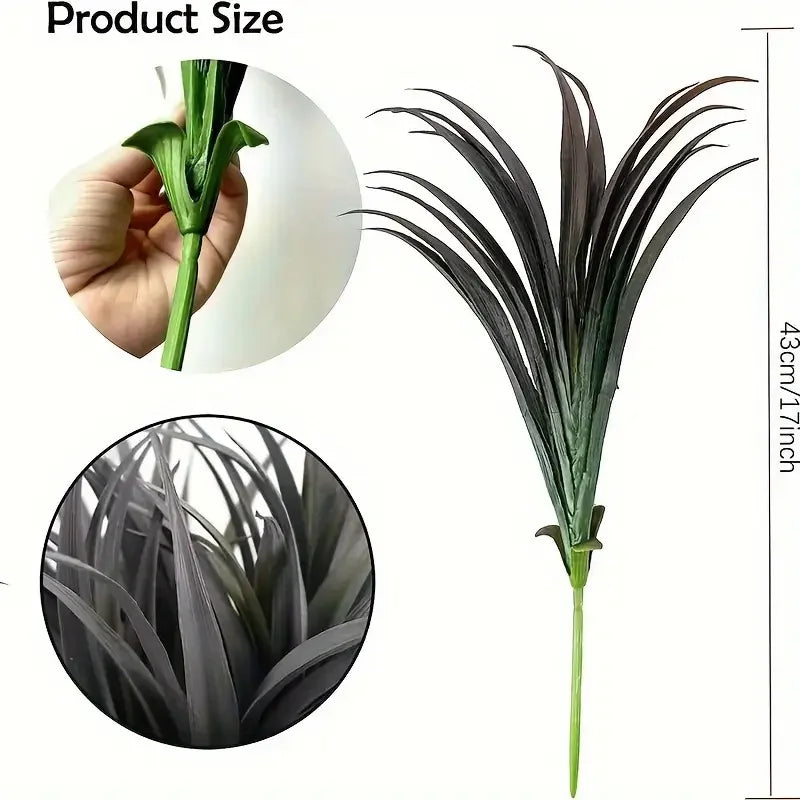 A hand holds a clump of artificial tall grass and tropical flowers, with a close-up view of the plant's texture.