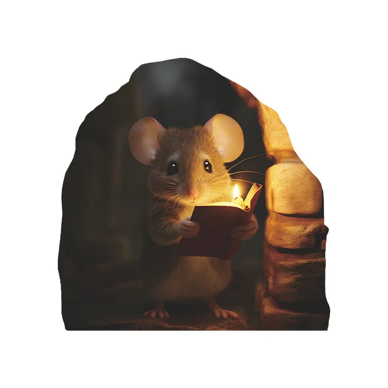 A small brown mouse holding an open book in a dark, cozy setting.