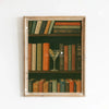 A framed display of vintage books in a wooden frame, featuring various spines and covers.