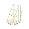 A gold-colored, three-tier iron display rack with a square base and rectangular shelves.