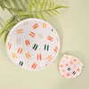 A round white fabric hand fan with orange and green stripes is shown next to a smaller, folded version on a light green backg