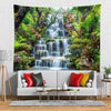 A panoramic tapestry featuring a lush green waterfall and rainforest scenery mounted on a wall.