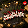 A festive bouquet of red and white artificial flowers arranged on a dark background with gold ornaments.