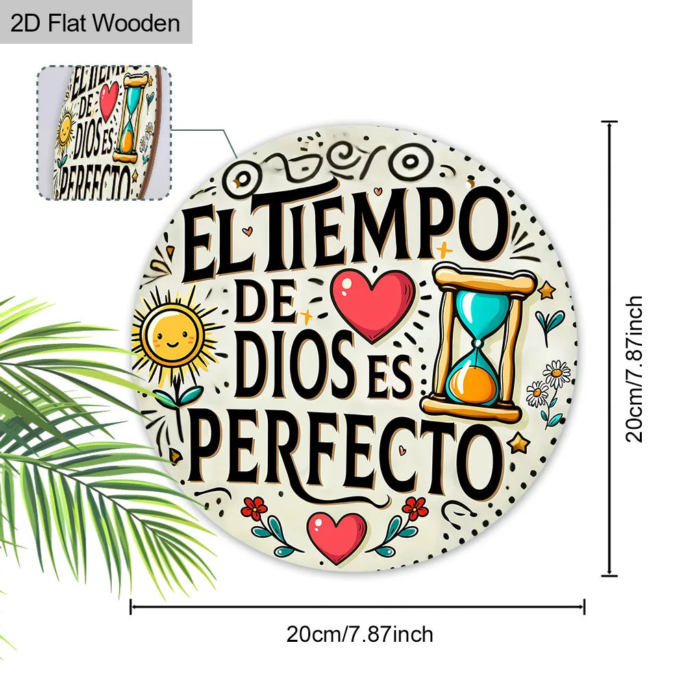 A round wooden plaque featuring the Spanish quote El tiempo de Dios es perfecto surrounded by hearts and a clock.