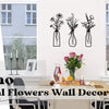 A set of three dried floral arrangements in glass vases displayed as wall decor above a wooden table.