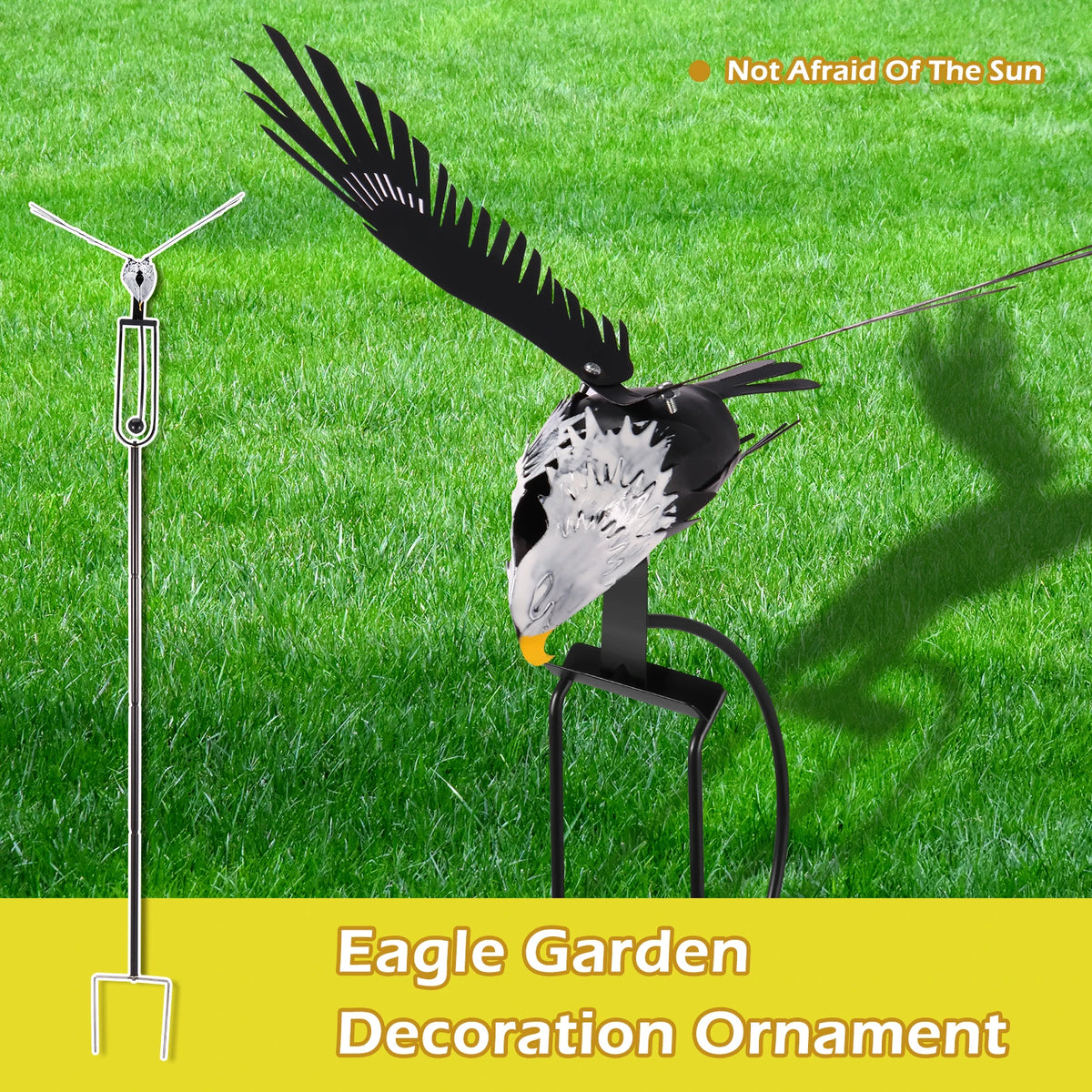 A black eagle wind spinner garden decoration ornament standing in green grass.