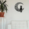 Black cat silhouette inside a crescent moon design wall decor sculpture on a white wall