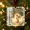 Clear acrylic ornament featuring a Christmas fireplace scene with an angel and gold accents hanging on a velvet ribbon.