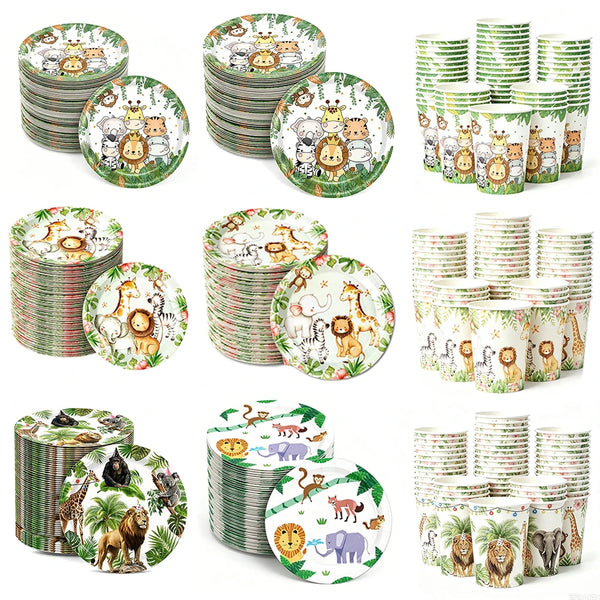 A collection of green and white safari animal themed paper plates, cups, and napkins for a party.