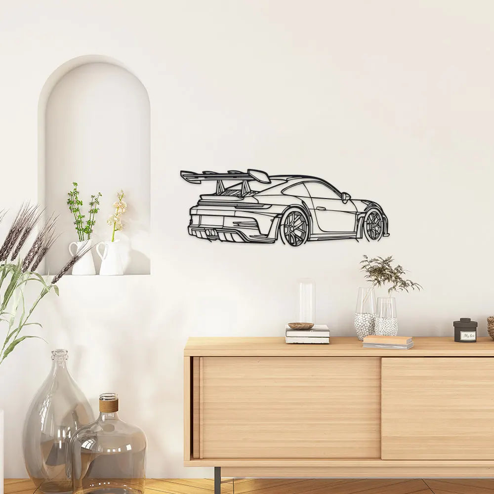 Black sports car metal wall art featuring a sleek modern car design mounted on a white wall.