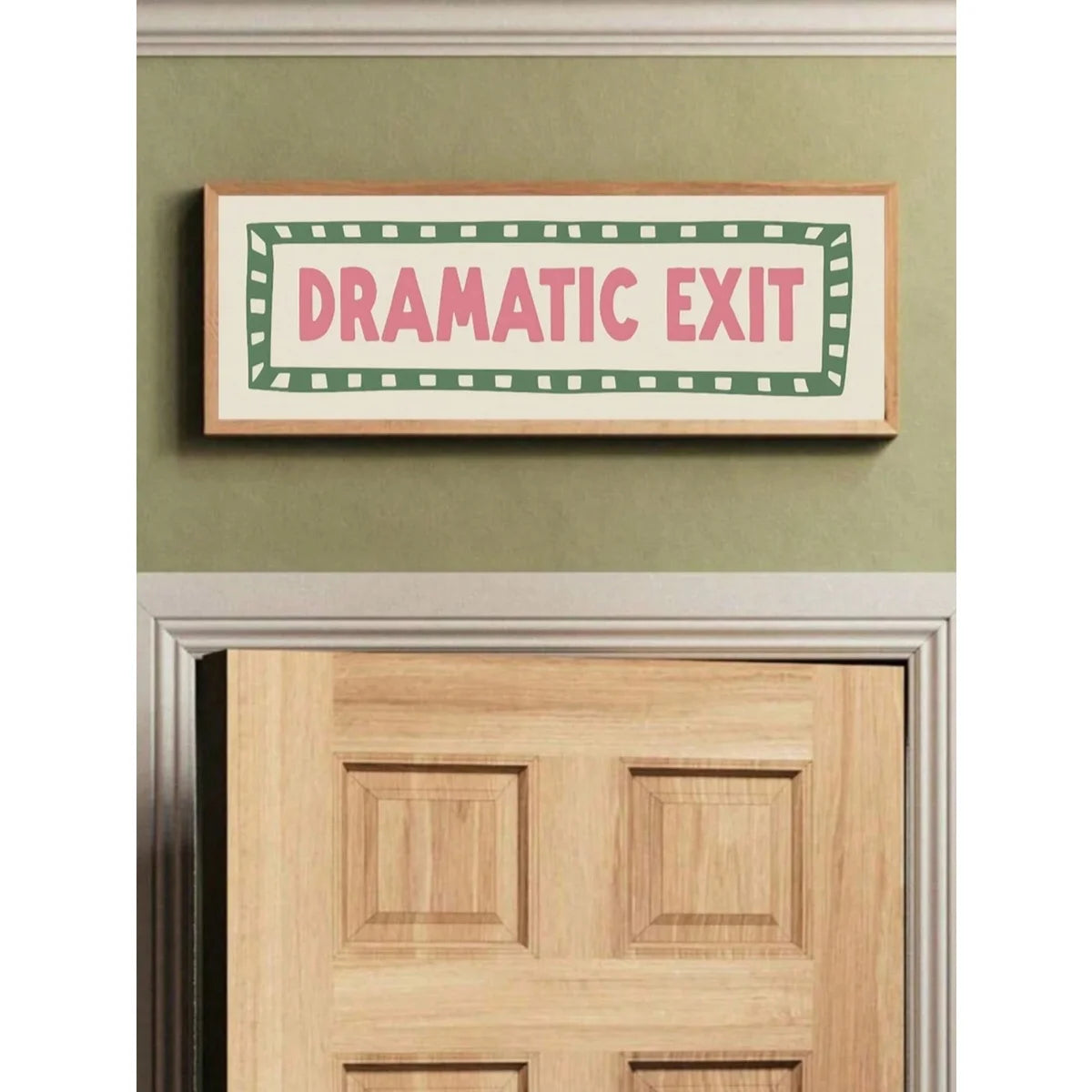 A framed canvas print with the text Dramatic Exit in pink lettering on a green background with a striped border.