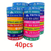 A set of twenty inspirational Bible verse silicone bracelets in various colors and designs.