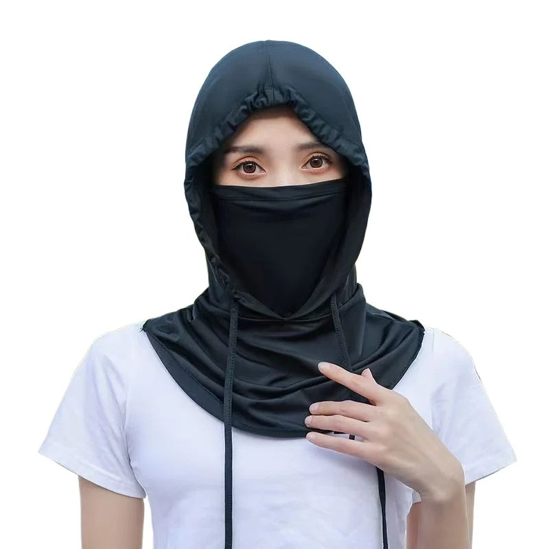 A person wearing a black breathable UV protection balaclava face mask and long neck cover over a white shirt.