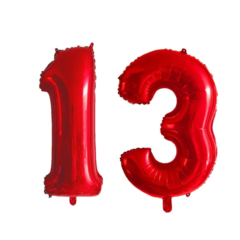 Two red helium foil number balloons shaped like 1 and 3