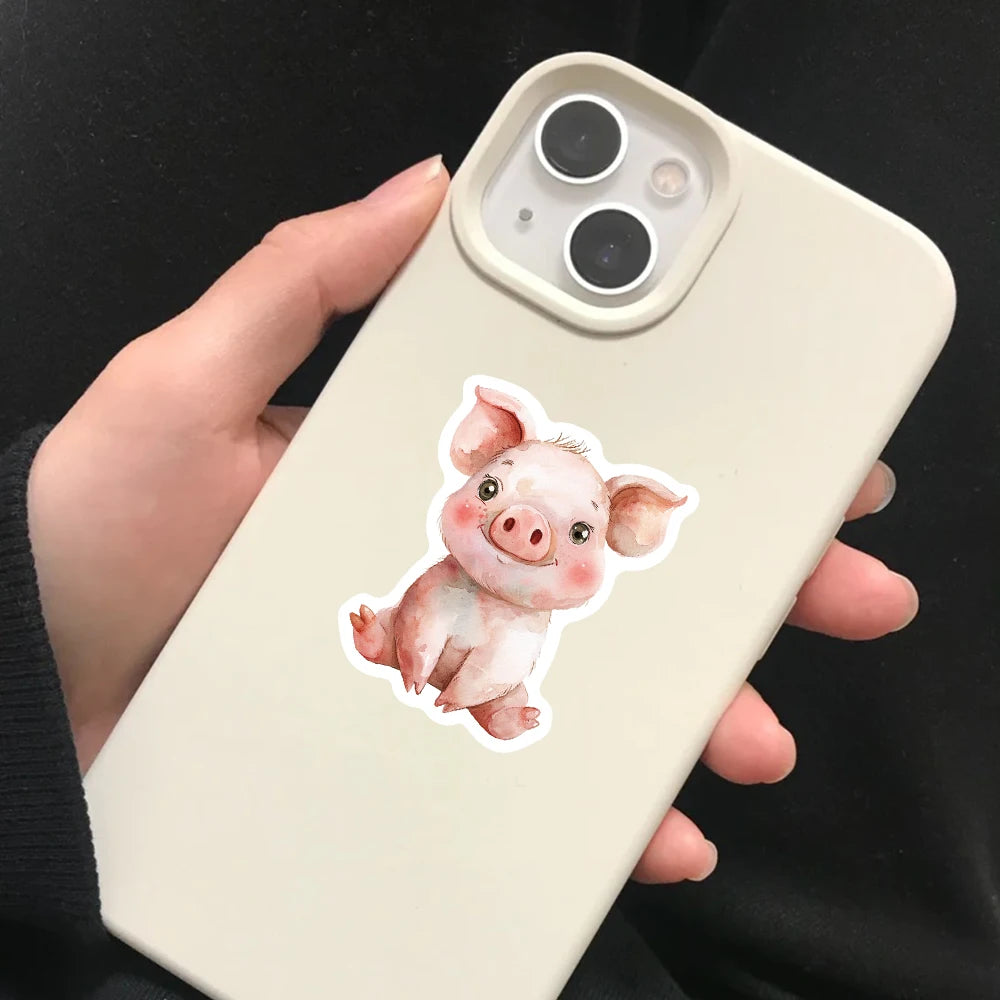 A hand holds a light beige smartphone displaying a watercolor illustration of a pink pig.