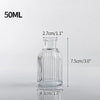 A clear glass bottle with a narrow neck and cylindrical body, measuring 7.5cm high and 4.3cm wide.