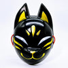 A glossy black fox face mask with yellow accents, designed for Halloween and costume parties.