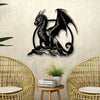A black metal dragon wall sculpture with wings set against a light gray textured wall.