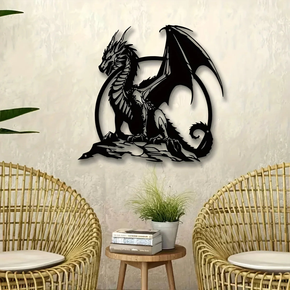A black metal dragon wall sculpture with wings set against a light gray textured wall.