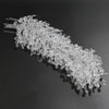 A set of acrylic crystal pendant drops for Christmas tree decor, arranged in a linear spray.