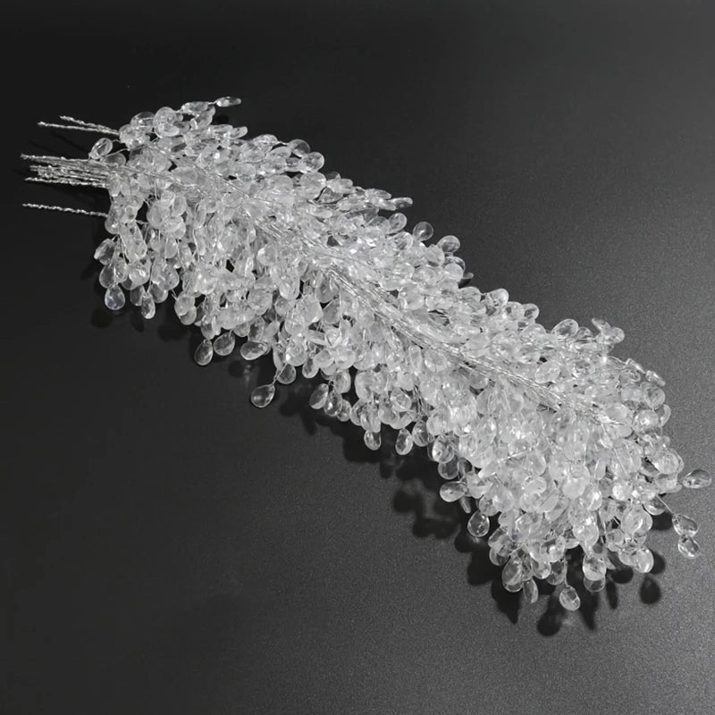 A set of acrylic crystal pendant drops for Christmas tree decor, arranged in a linear spray.