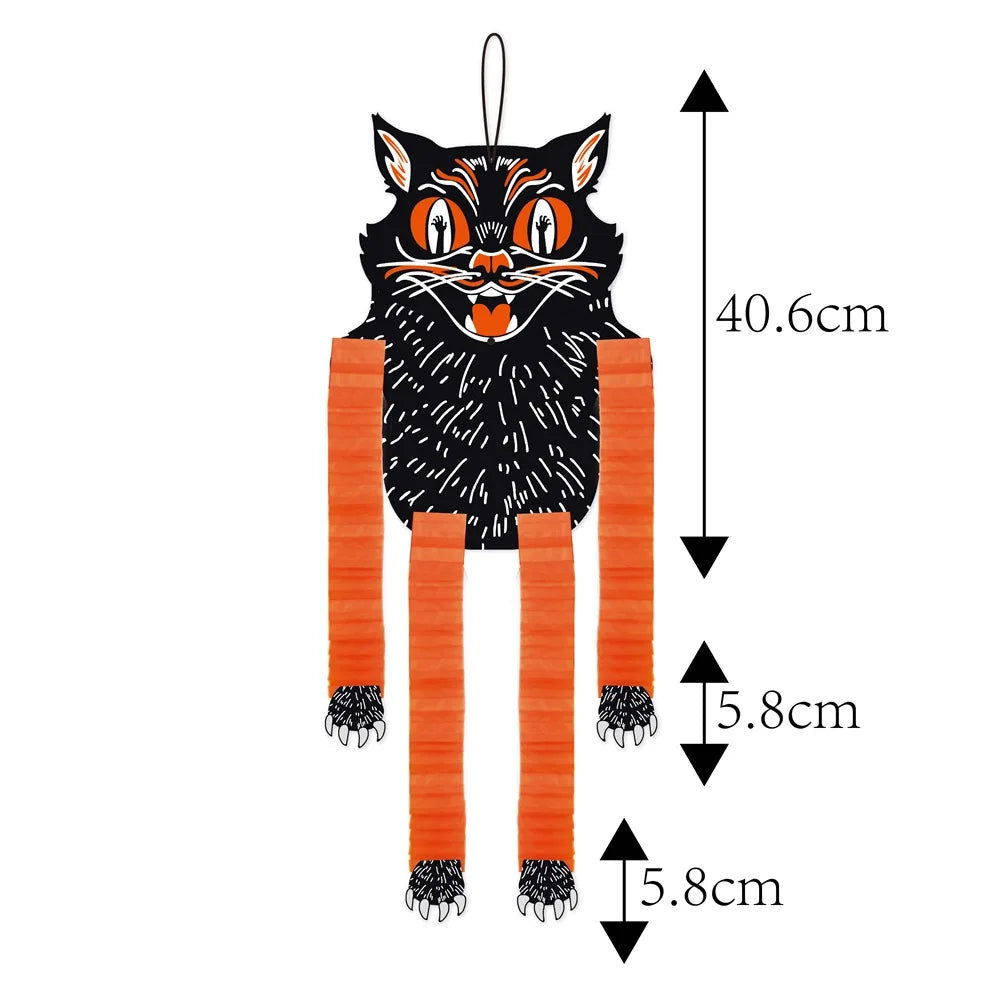 A black cat hanging ornament with orange legs and facial features, shown against a white background.