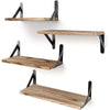 Three natural wood floating wall shelves with black metal brackets mounted on a white wall.