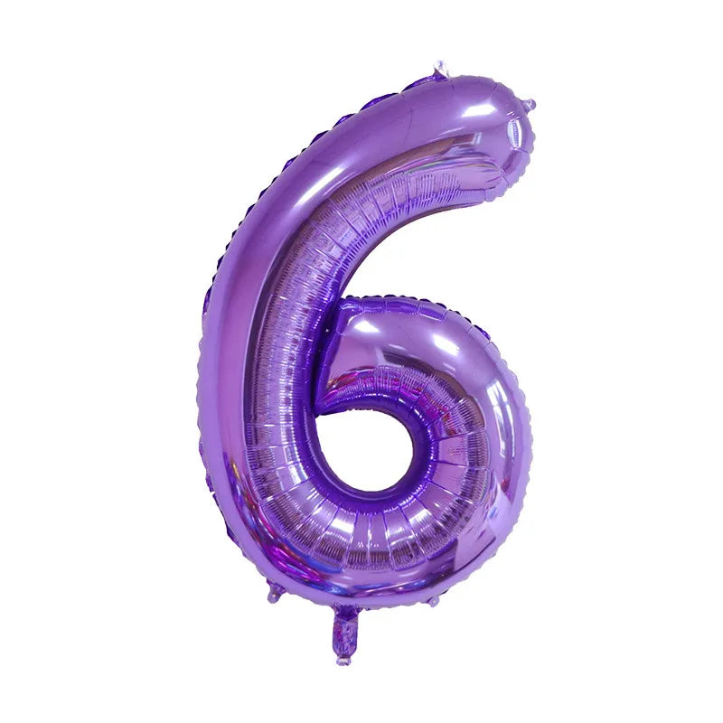 A purple foil balloon shaped like the number six for celebrations.