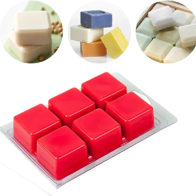 A collection of various colored wax melts and molds, including white, blue, yellow, and red, displayed in a clear plastic cla