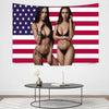 A woman posing in a black bra and panties against an American flag tapestry background.