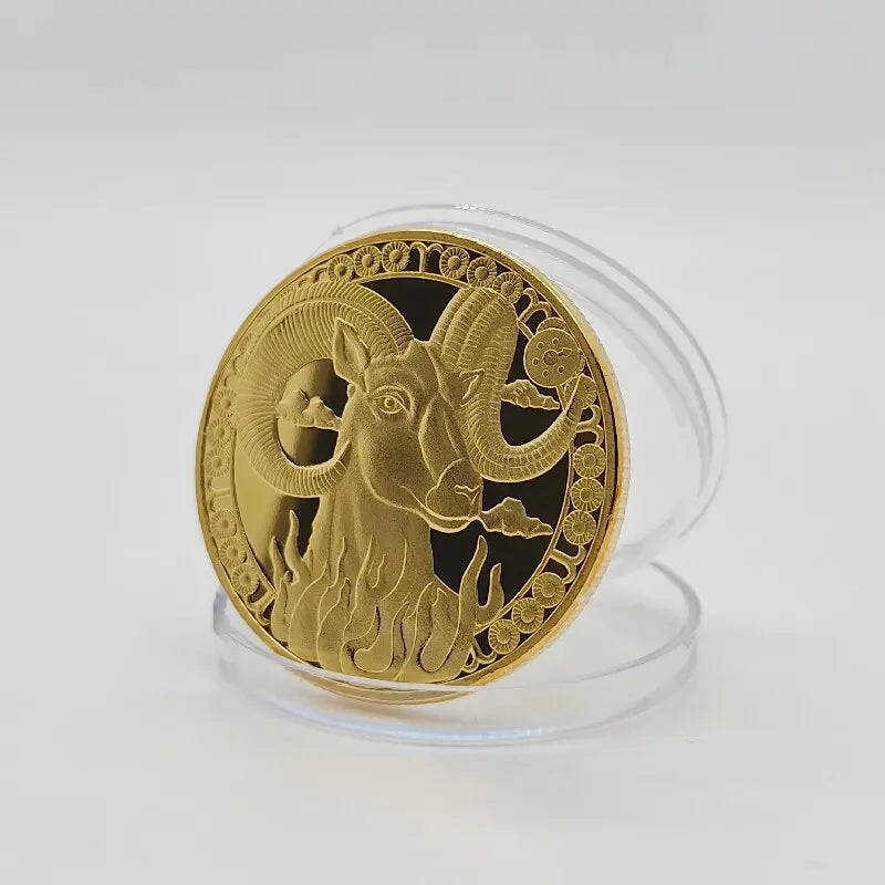 A round gold commemorative iron coin featuring a detailed depiction of a ram's head and flames.