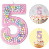 Pink macaron number 5 birthday candle set featuring a large cutout and a cupcake design