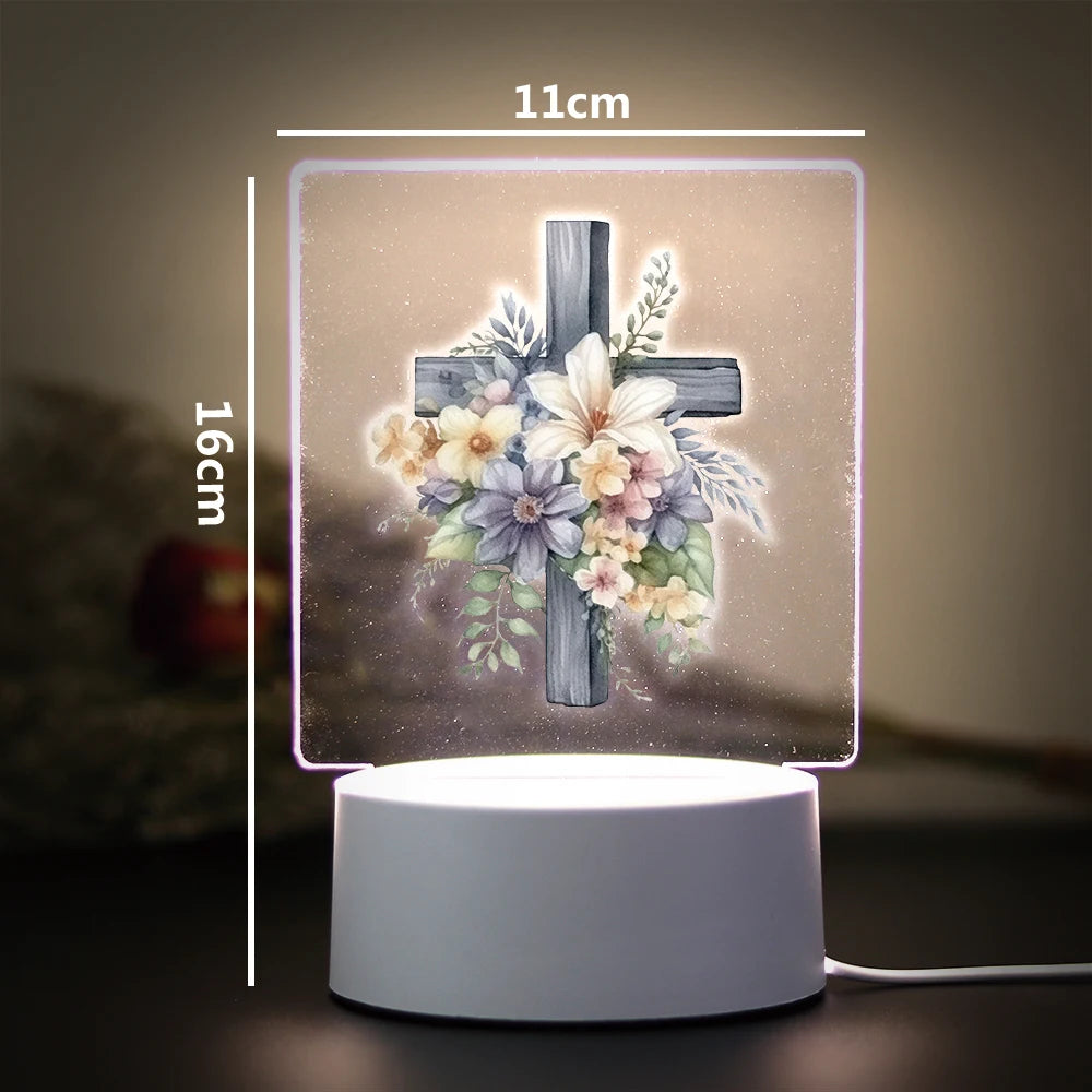 A 16cm LED night light featuring a wooden cross adorned with white and purple flowers.