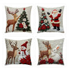 A set of four festive Christmas linen throw pillow covers featuring reindeer, Santa Claus, and a decorated Christmas tree.