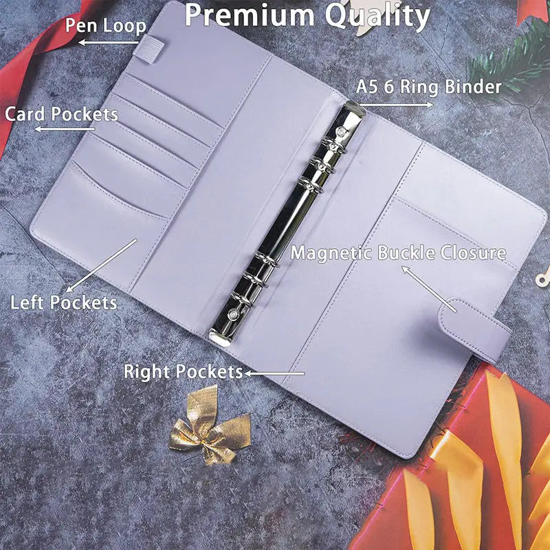 A premium purple A5 ring binder with pen loops and pockets shown open on a gray surface.