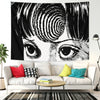 A black and white manga-style tapestry featuring a close-up of an intense eye.