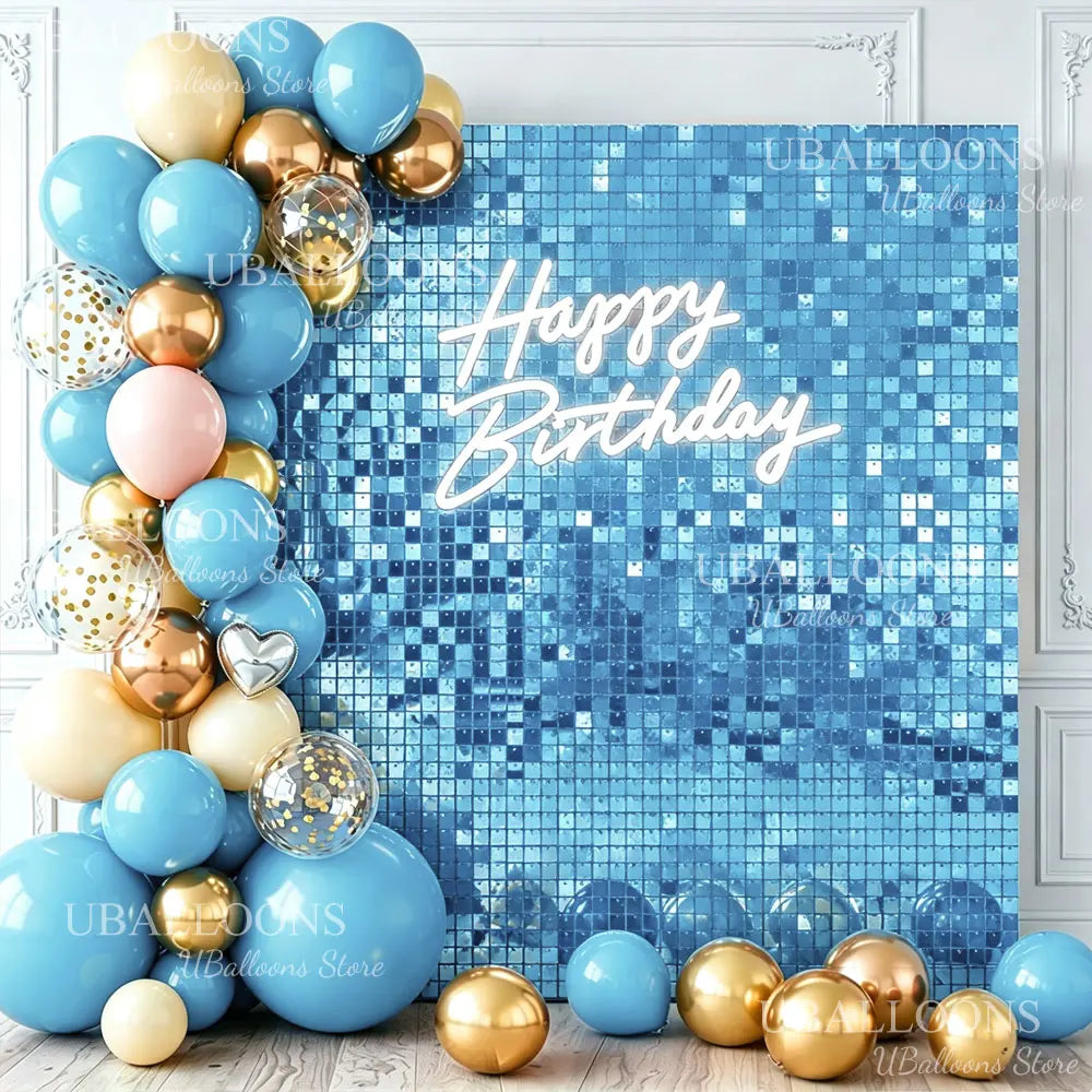 A blue and gold balloon arrangement against a shimmering blue grid wall backdrop with Happy Birthday text.