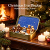 A gold storage box containing a nativity scene figurine set with figures and a blue starry background.