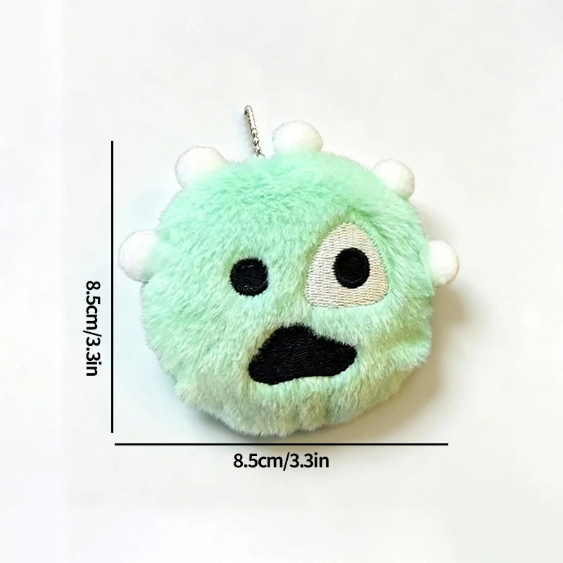 A light green plush doll with black facial features and white tufts, shown against a white background.