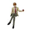 PVC figure of Death Note character Light Yagami with orange hair, wearing a light suit and holding an apple.