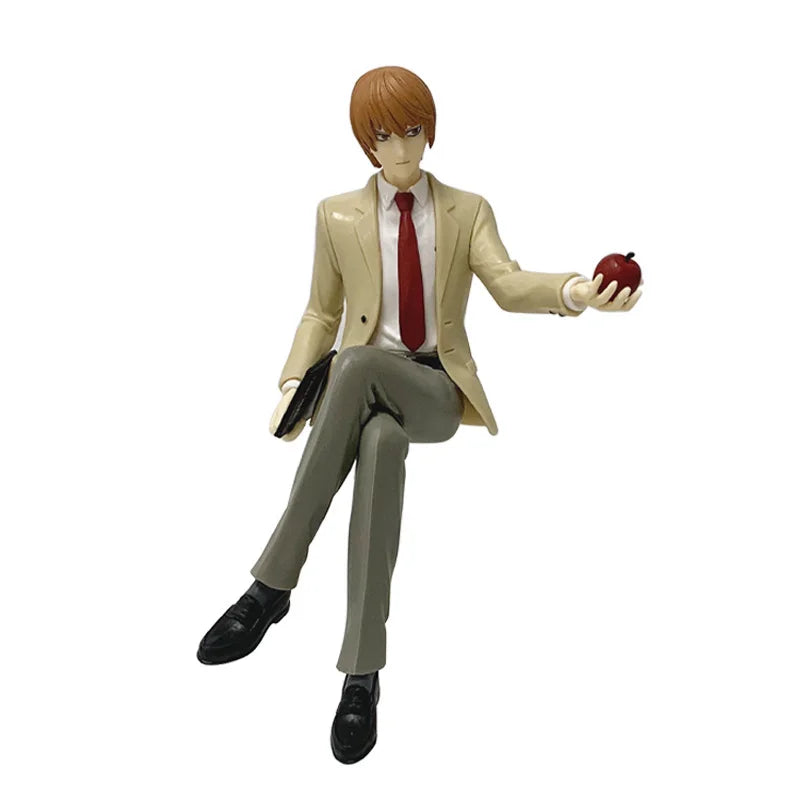 PVC figure of Death Note character Light Yagami with orange hair, wearing a light suit and holding an apple.