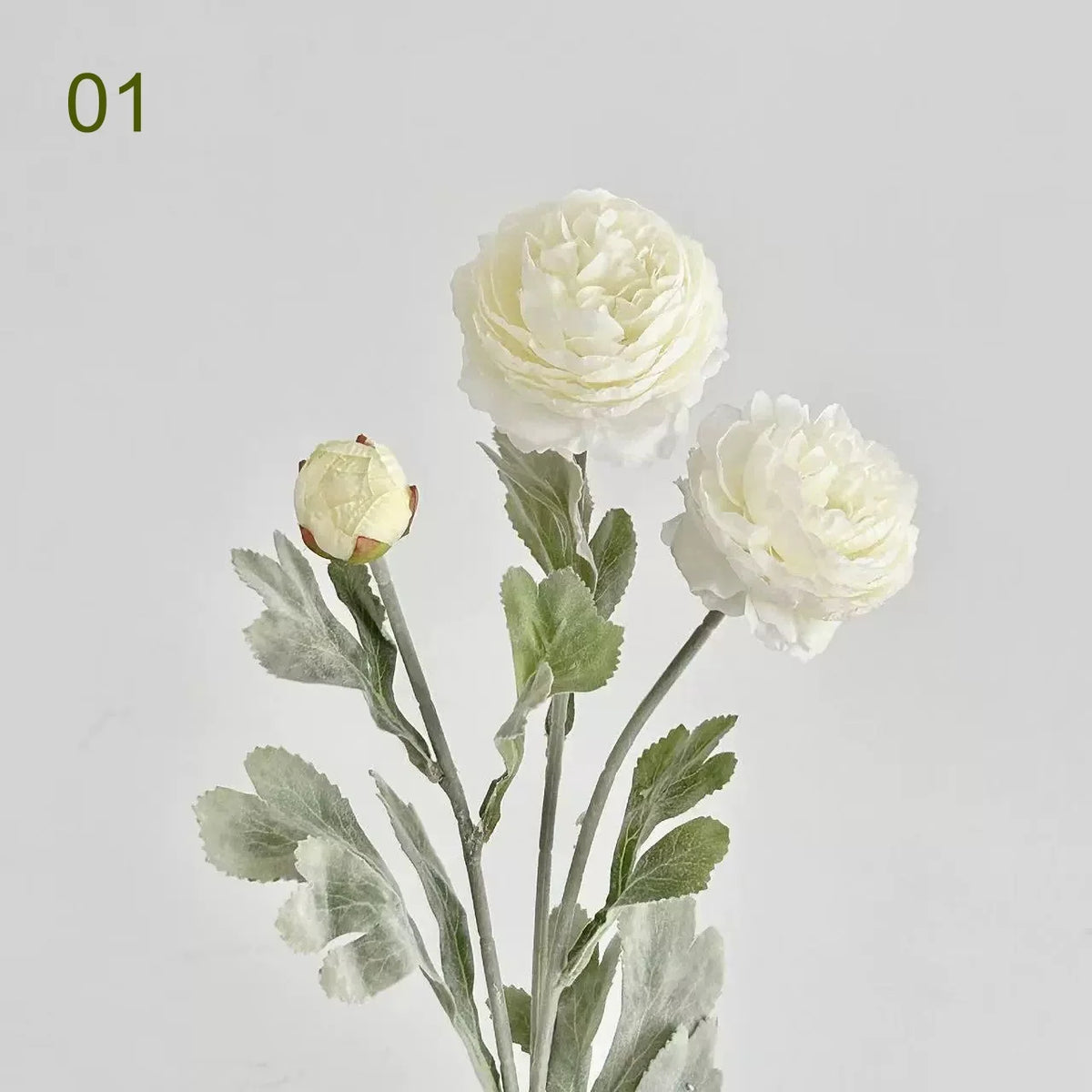 A bouquet of white silk peony flowers with green leaves and stems.
