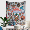 A colorful tapestry featuring a wild tiger and vintage tattoo designs of women.