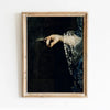 A framed dark academia vintage canvas wall art print featuring a moody Victorian print of a hand painting on a dark backgroun