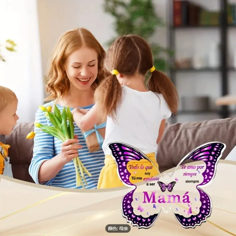 A mother and child smiling while holding a butterfly acrylic keepsake plaque for mom
