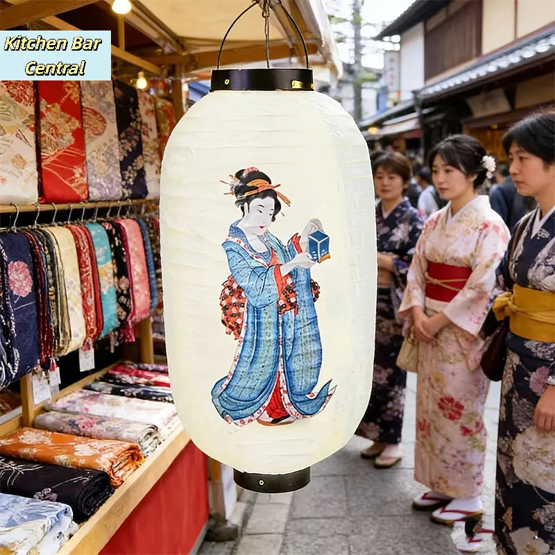 A white Japanese paper hanging lantern featuring a blue and white illustration of a woman in traditional attire.