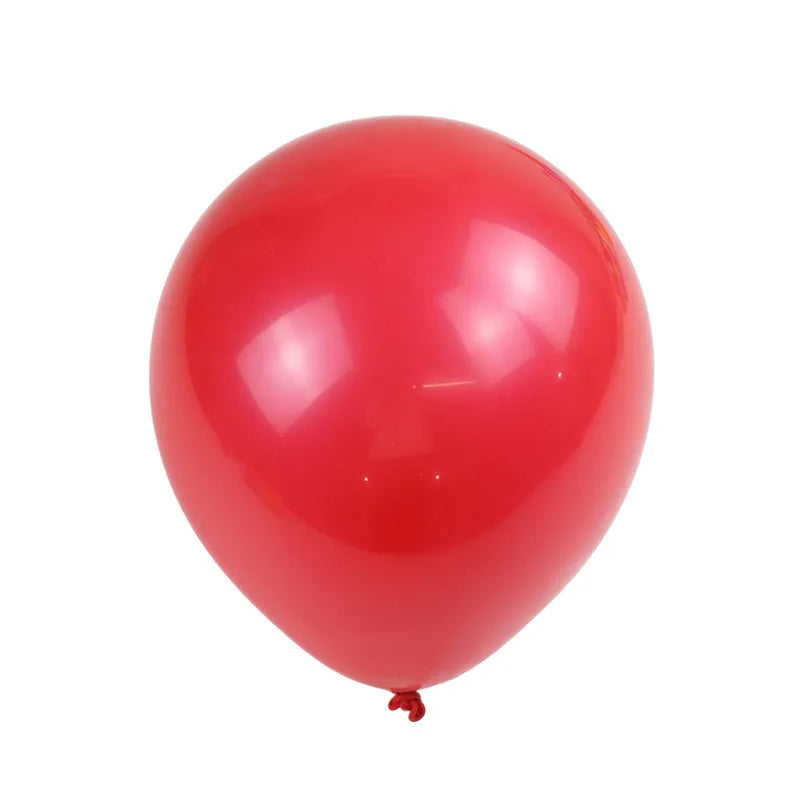 A single, glossy red latex balloon against a white background.