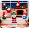 Festive resin Christmas dwarf figurine set featuring Santa, elves, and reindeer decorations