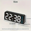A black LED digital alarm clock displaying the time 22:38 with ambient glow and date information.