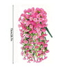 A vertical display of pink silk morning glory vine hanging flowers with green stems.